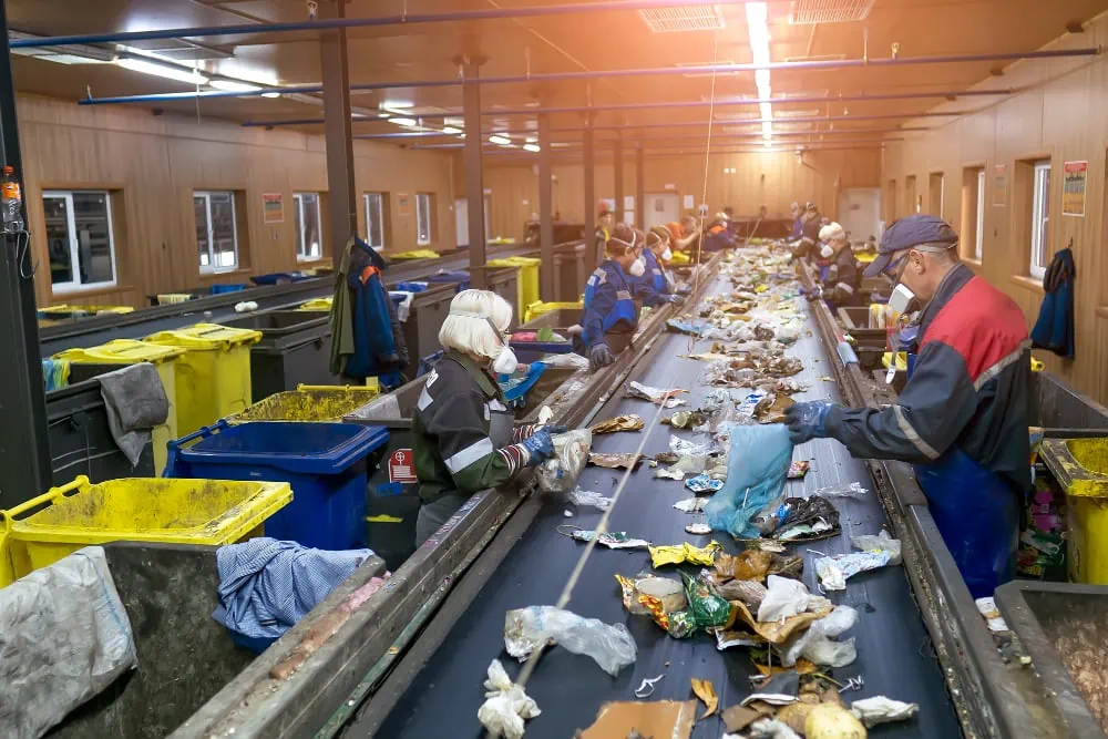 conveyor sorting garbage waste by people garbage processing